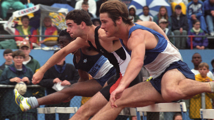 (Kitchener, Canada---07 June 1996) Left to right, Jeff Keays (2nd) and J Hollingsworth (1st) racing in the junior boys 110m hurdles at the 1996 OFSAA Ontario High School Track and Field Championships. Photo 1996 Copyright Sean Burges / Mundo Sport Images.
