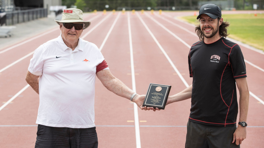 (Ottawa, Canada---05 June 2021) Barclay Frost receiving an appreciation award for a lifetime of officiating from Ottawa Lions Executive Director Richard Johnston at the Ottawa High Performance Weekend, held at the Terry Fox Athletic Facility. Photograph copyright 2021 Sean Burges / Mundo Sport Images
